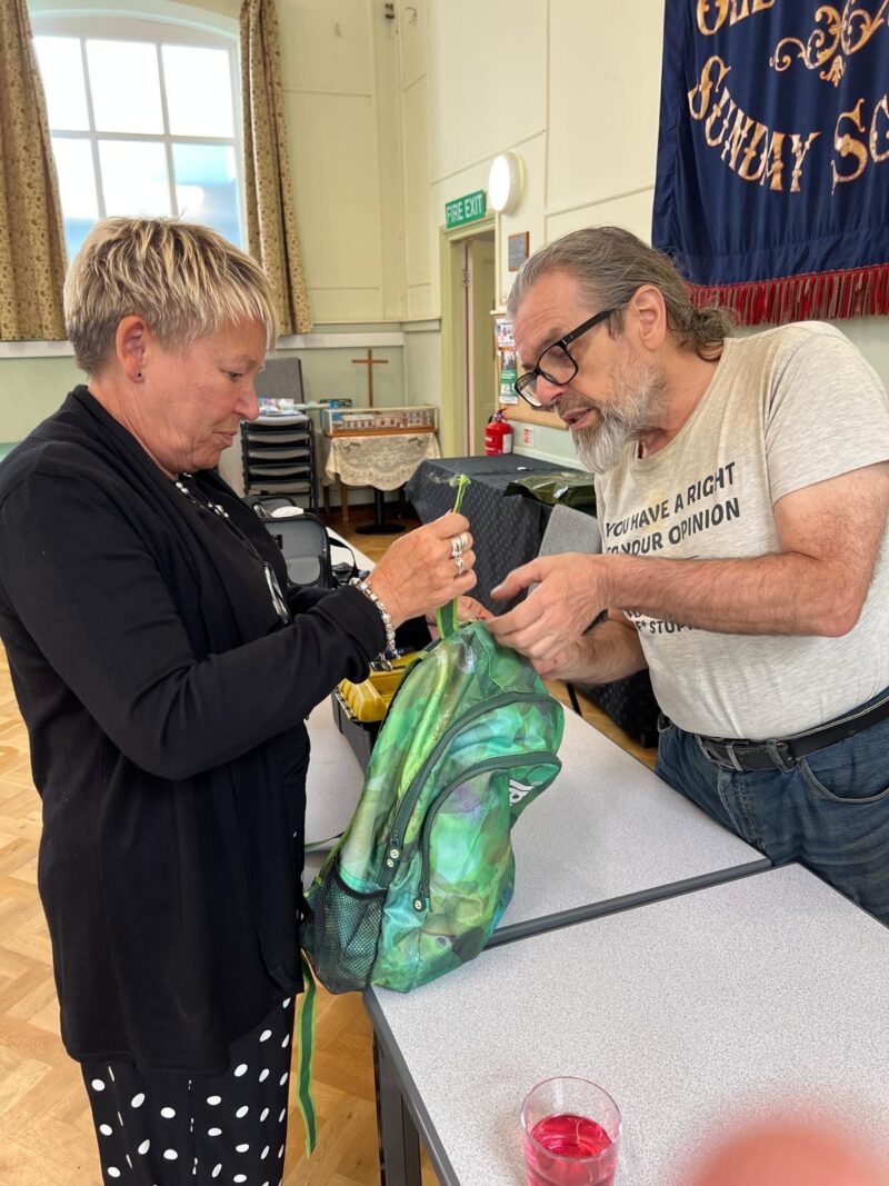 Rachel taking her bag to the repair cafe