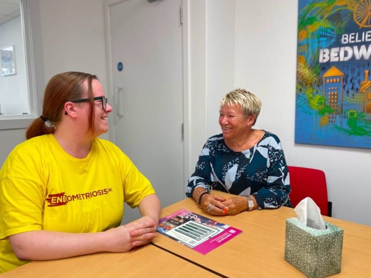Rachel speaking to Stevie at her surgery about her Endometriosis UK support group