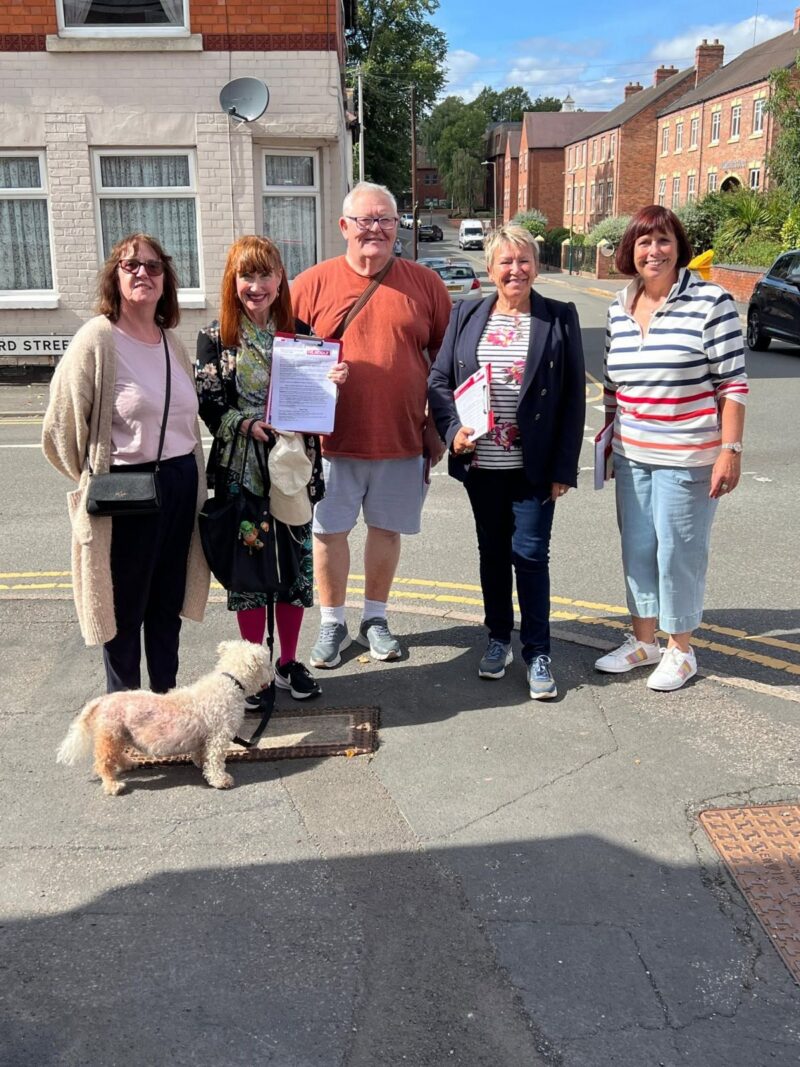 Rachel and her volunteers with her petition for proper toilets